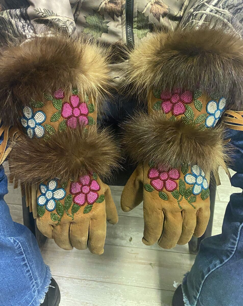 Tan moosehide gauntlets with floral beadwork and fur cuffs